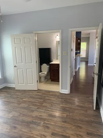 a view of a livingroom with furniture and wooden floor