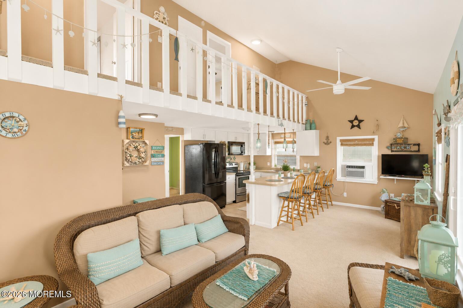 246 Cove Road Newport, NJ 08345 - Photo 4 of 21 a living room with furniture a flat screen tv and kitchen view
