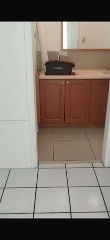 a kitchen with a sink and a stove