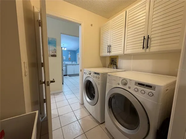a view of a kitchen with washer and dryer
