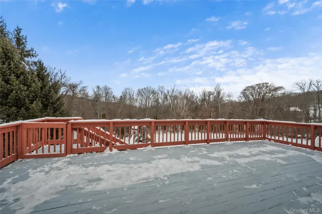 a view of a street with a wrought fence