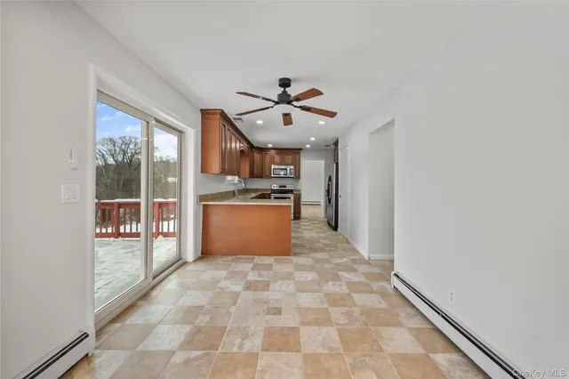 a view of a kitchen with a sink and a window