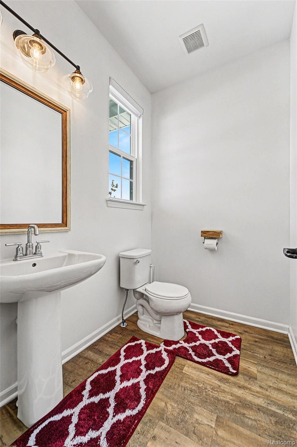 2471 Massoit Road Royal Oak, MI 48073 - Photo 17 of 49 Half bath with wood finished floors