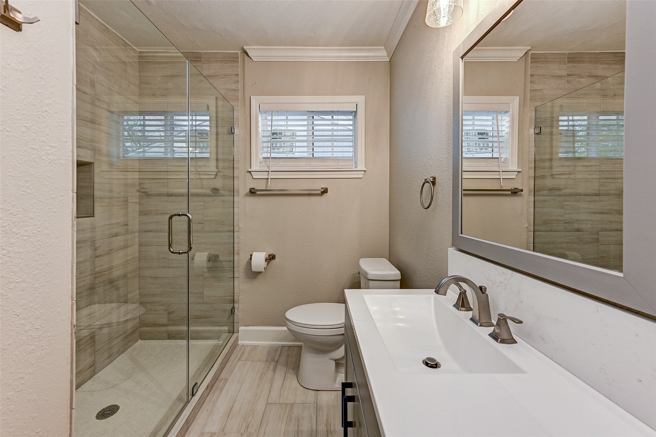 6618 Winton Street Houston, TX 77021 - Photo 16 of 20 a bathroom with a sink a toilet and shower