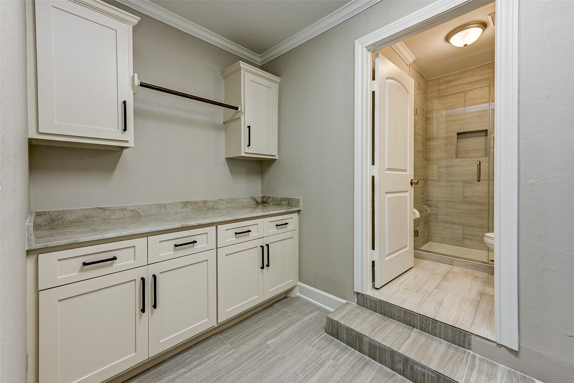 6618 Winton Street Houston, TX 77021 - Photo 17 of 20 a view of a kitchen with white cabinets