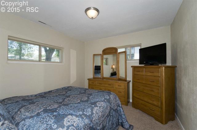 615 Sunset Road Colorado Springs, CO 80909 - Photo 12 of 20 Master Bedroom lets in plenty of sunshine.