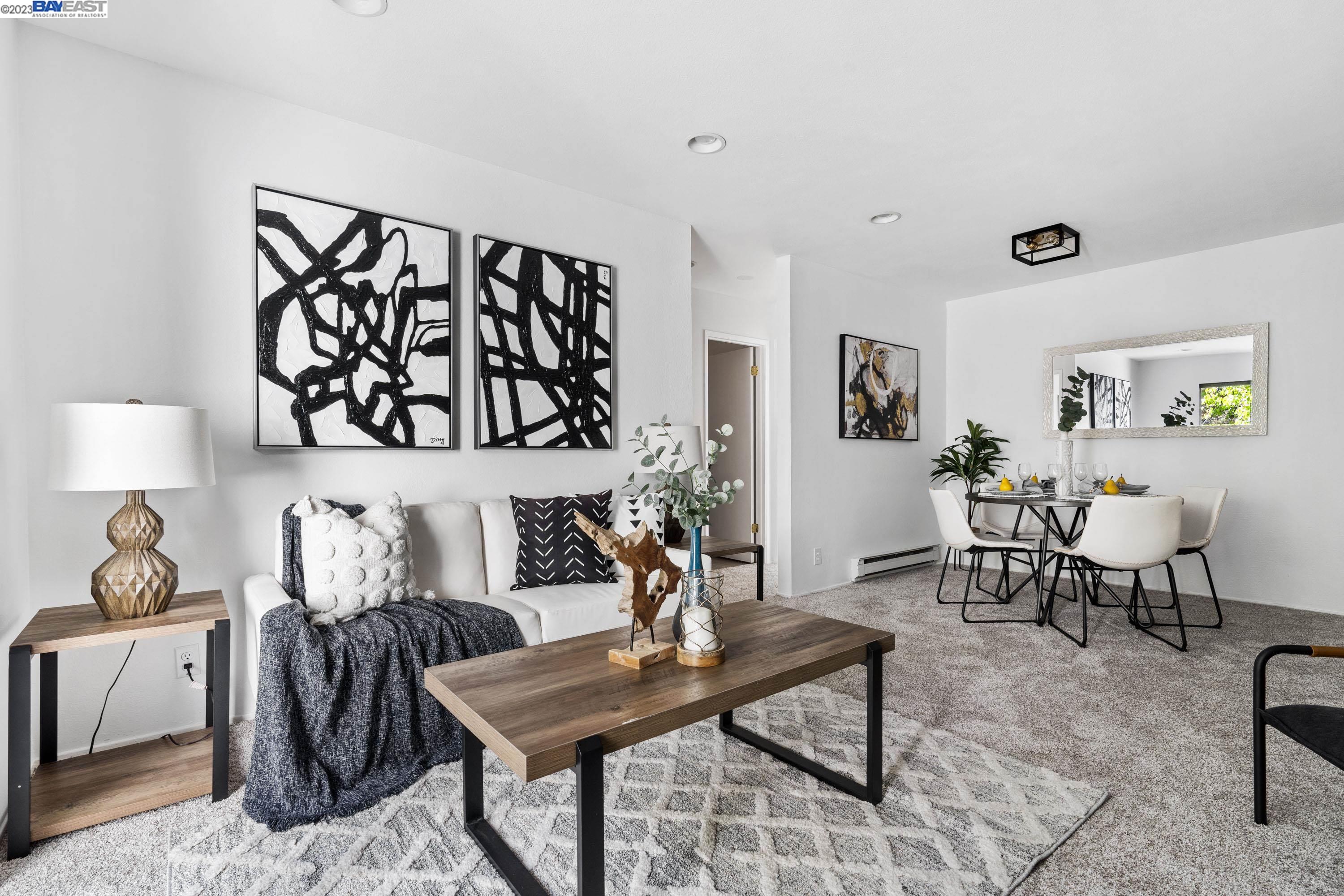 1055 North Capitol Avenue, Unit 86 San Jose, CA 95133 - Photo 1 of 1 a living room with furniture and wooden floor
