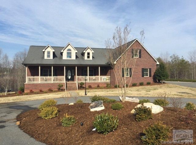 1331 Bethel Road Morganton, NC 28655 - Photo 1 of 10 a view of a white house with a large windows next to a yard