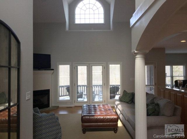 1331 Bethel Road Morganton, NC 28655 - Photo 2 of 10 a living room with furniture and a floor to ceiling window