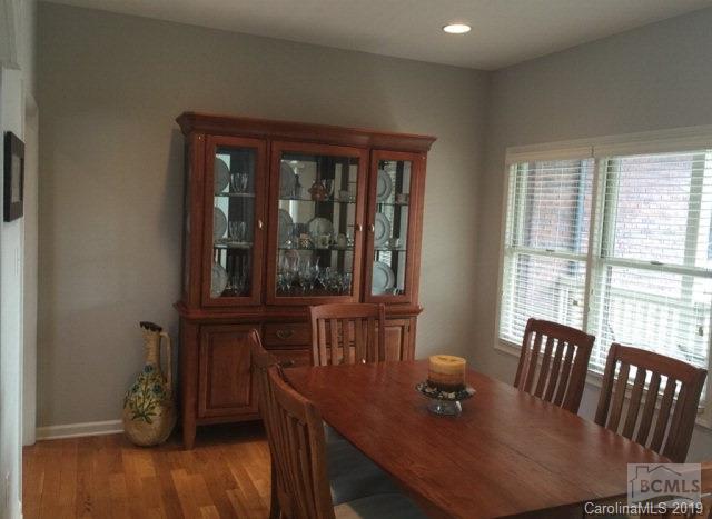 1331 Bethel Road Morganton, NC 28655 - Photo 6 of 10 a view of a dining room with furniture window and wooden floor