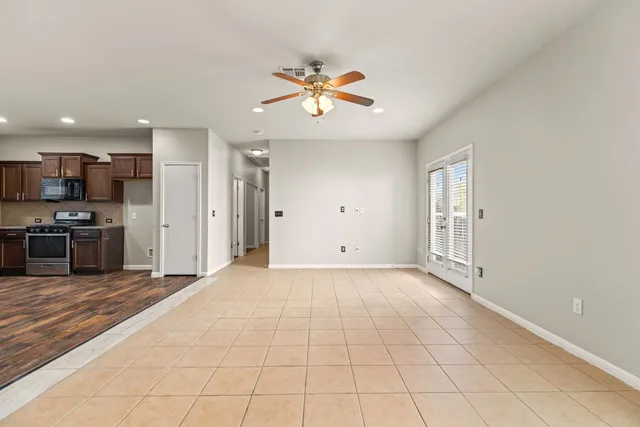 a view of kitchen appliances and cabinets