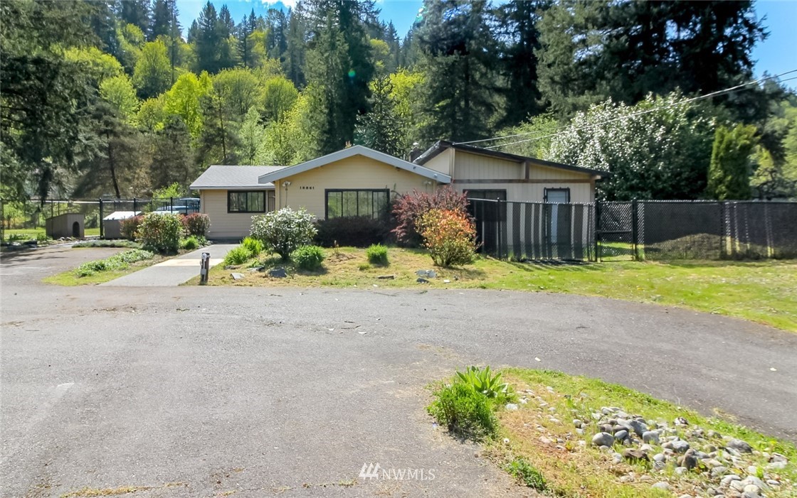 19861 Renton-Maple Valley Road Renton, WA 98058 - Photo 27 of 32 a view of a house with a yard and large trees