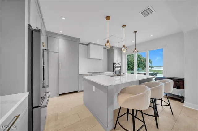 a bathroom with a sink and mirror with toilet