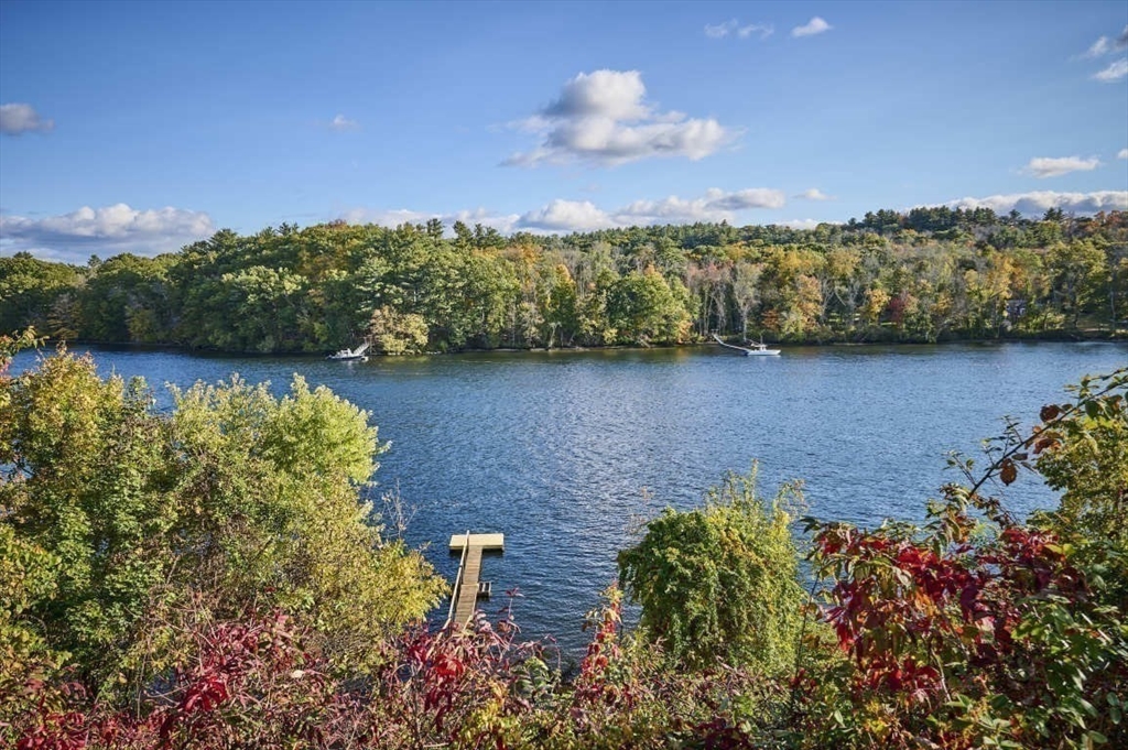 97 River Road Merrimac, MA 01860 - Photo 7 of 42 a view of a lake with a mountain in the background
