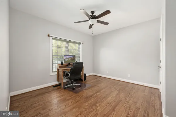 a view of a livingroom with furniture and a window