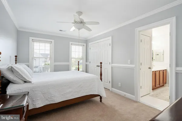 a bedroom with a bed and a table in it
