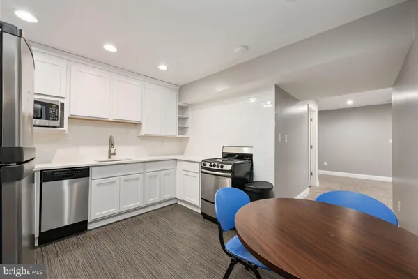 a view of a swimming pool with a table and chairs