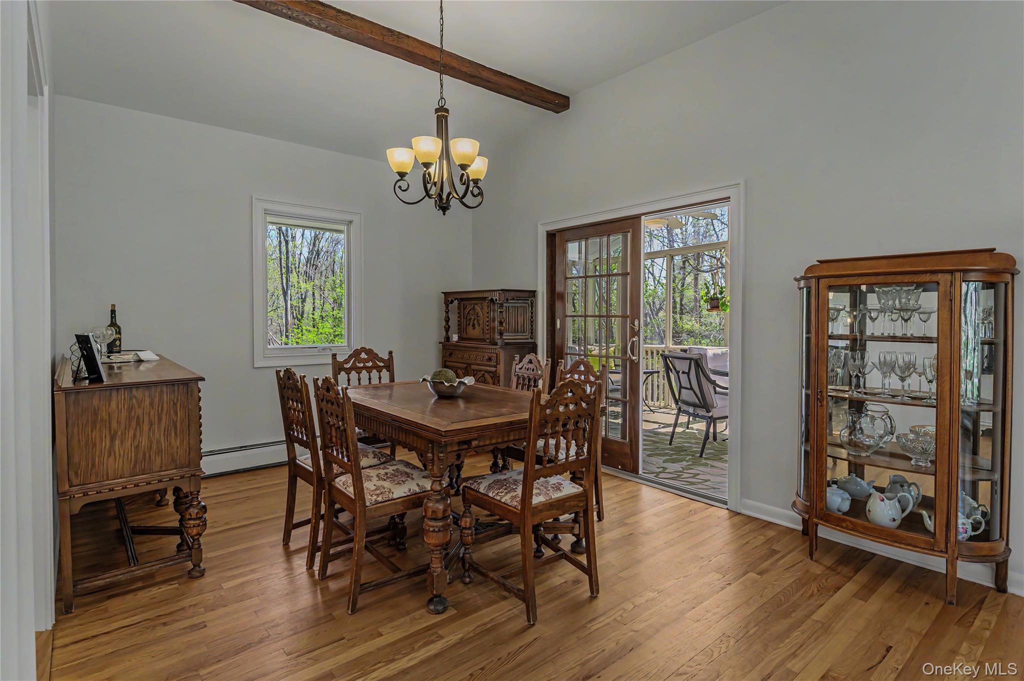 41 Cross Pond Road Pound Ridge, NY 10576 - Photo 14 of 41 a view of a dining room with furniture a chandelier and wooden floor
