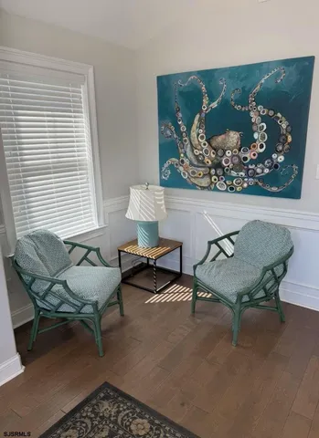 a living room with furniture and a rug