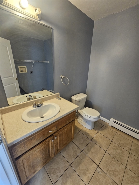 40 Merrick Street, Unit A Worcester, MA 01609 - Photo 10 of 32 a bathroom with a sink and a toilet