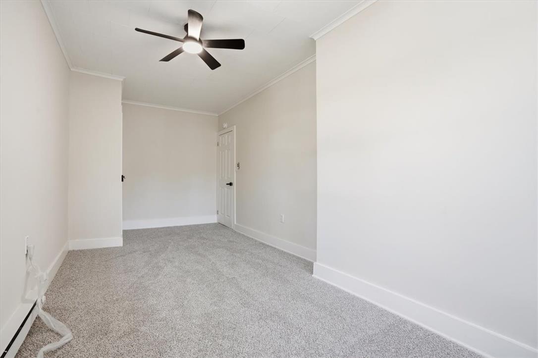 110 Messinger Street Bangor, PA 18013 - Photo 19 of 39 A well-lit, neutral-toned room features new carpeting and a contemporary ceiling fan, ready for personal touches.