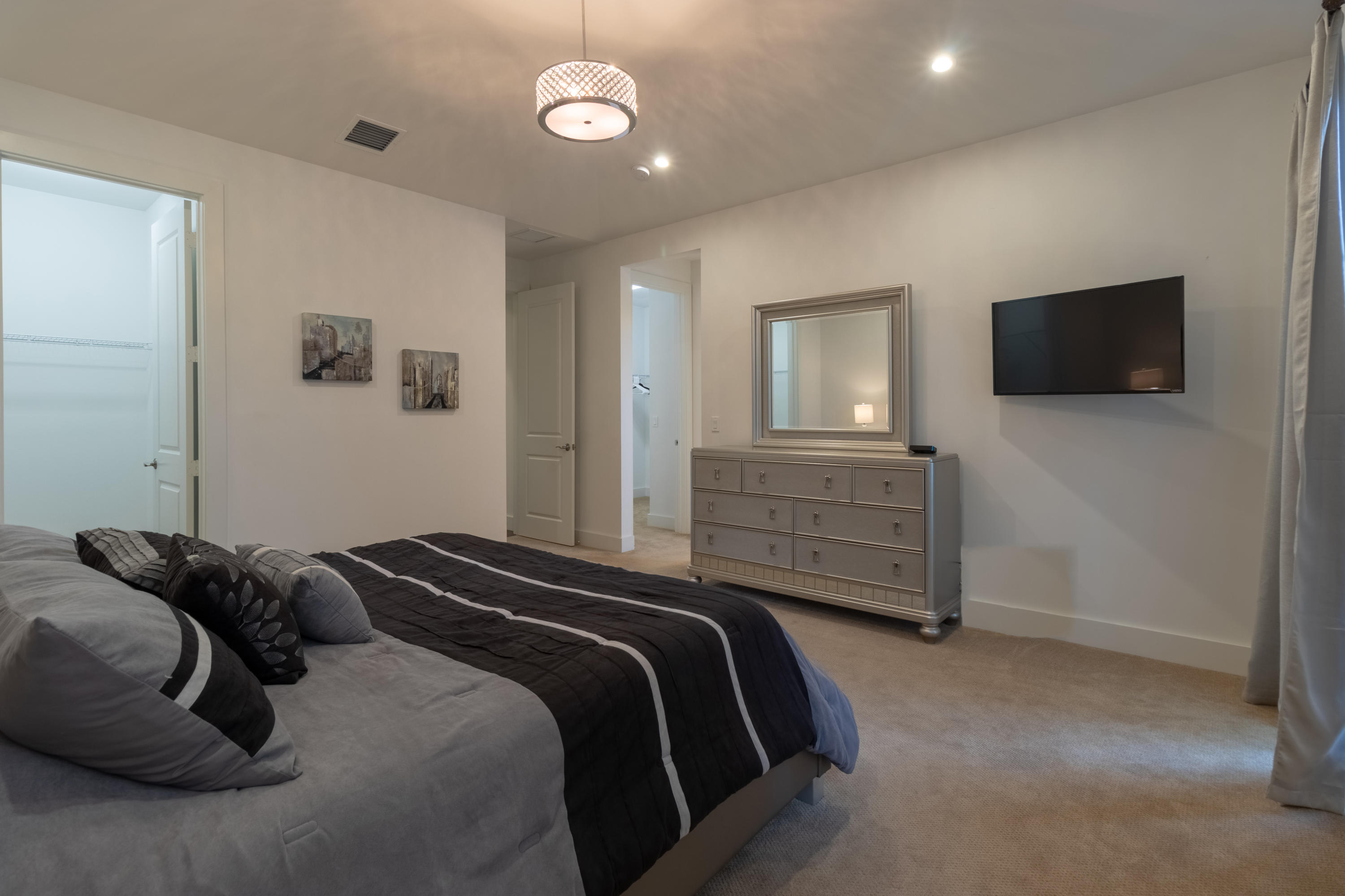 1085 Phillips Road Delray Beach, FL 33483 - Photo 12 of 32 a bedroom with a bed and a flat screen tv