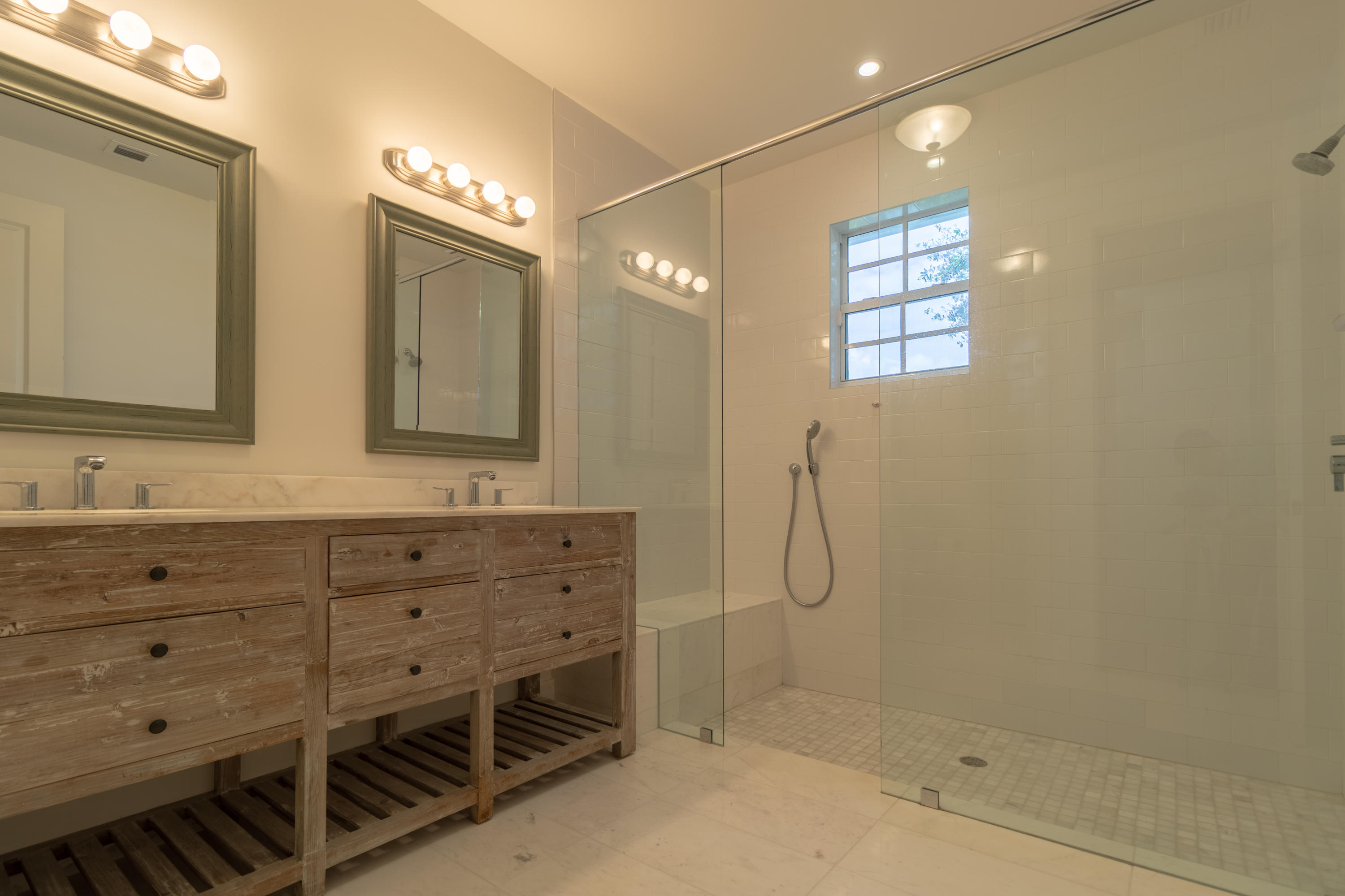 1085 Phillips Road Delray Beach, FL 33483 - Photo 13 of 32 a bathroom with a shower sink and mirror