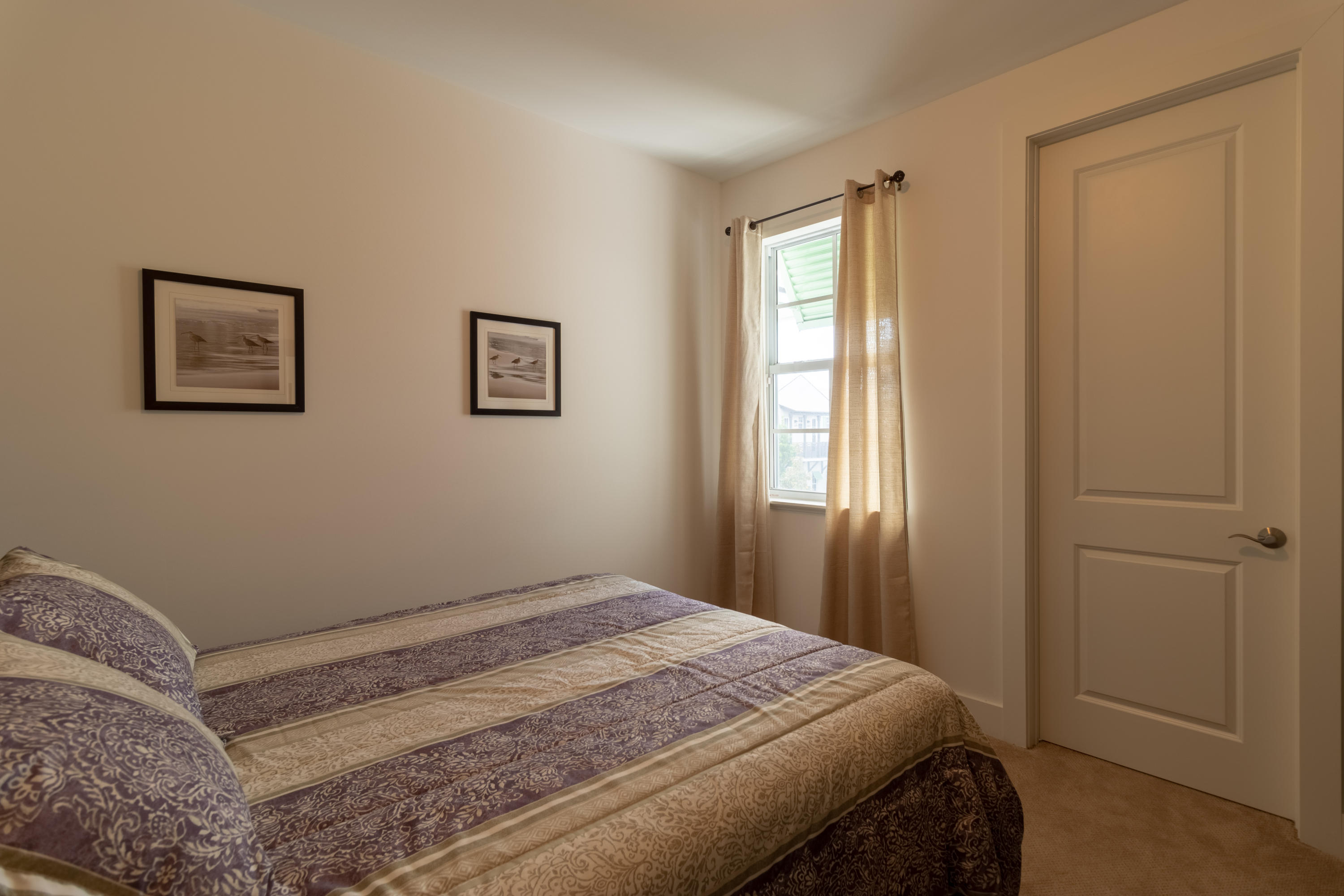 1085 Phillips Road Delray Beach, FL 33483 - Photo 15 of 32 a bedroom with a bed and a window