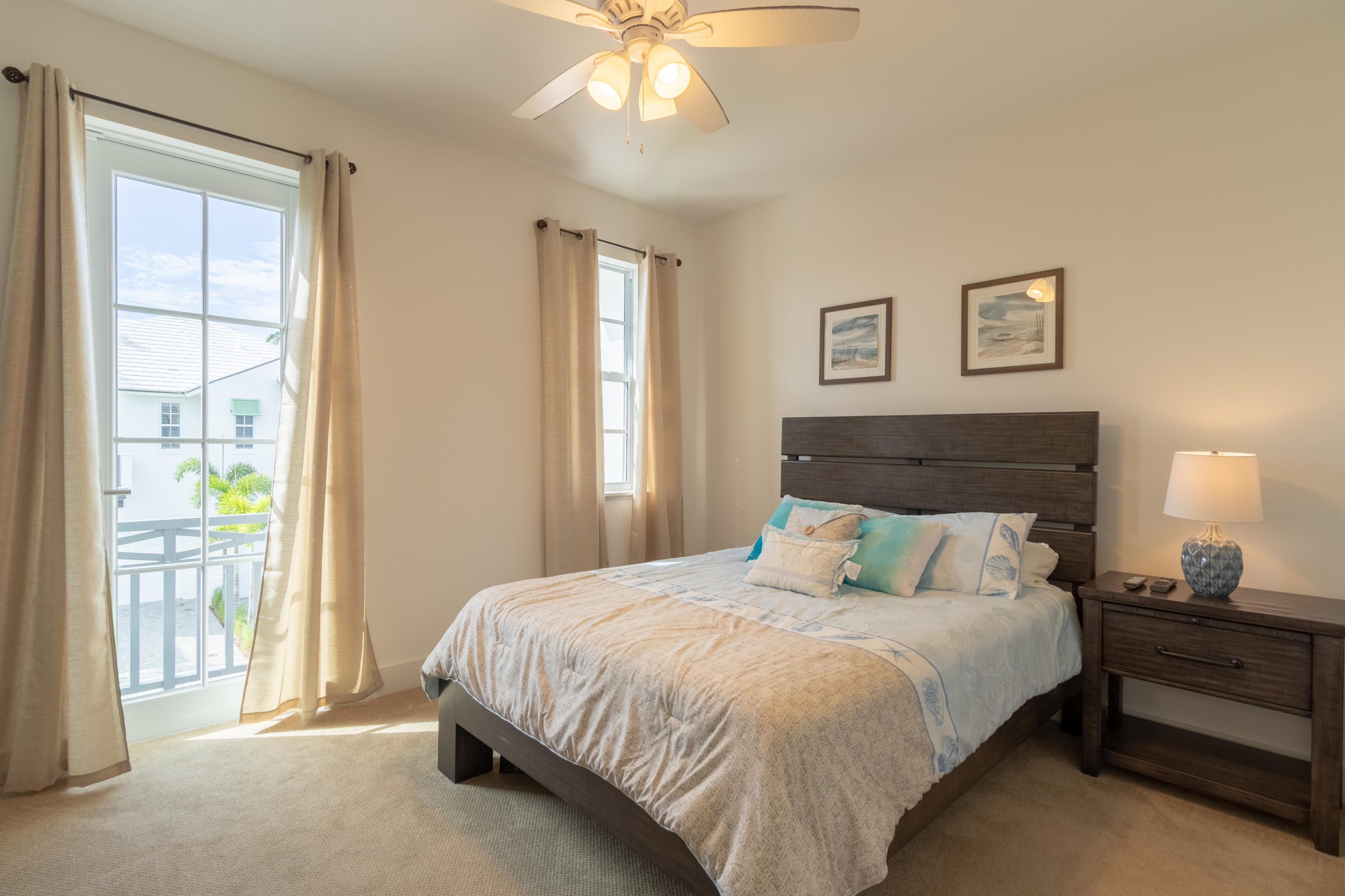 1085 Phillips Road Delray Beach, FL 33483 - Photo 19 of 32 a bedroom with a bed and a window