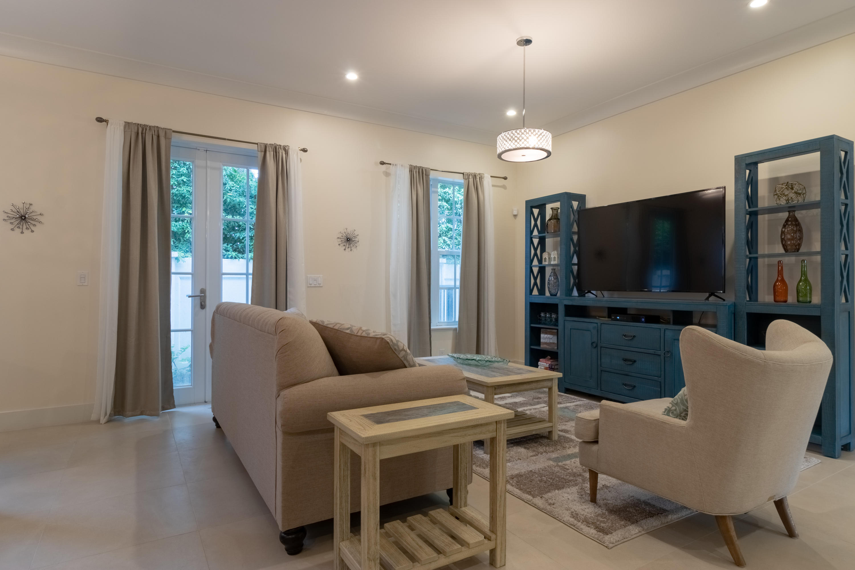 1085 Phillips Road Delray Beach, FL 33483 - Photo 3 of 32 a living room with furniture and a flat screen tv