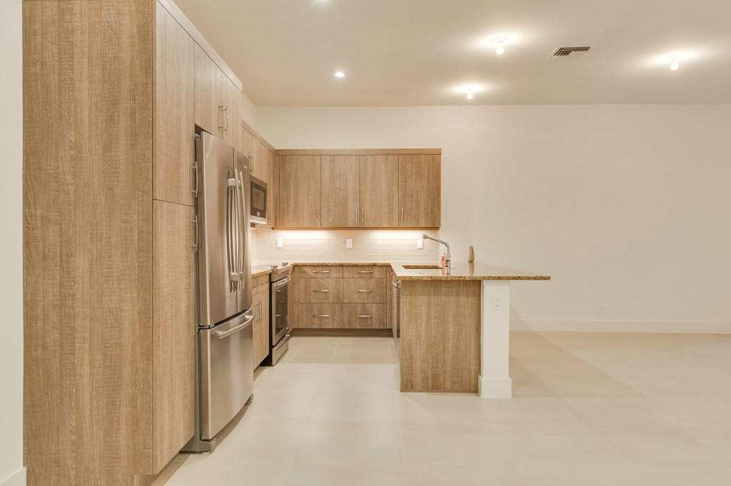 1085 Phillips Road Delray Beach, FL 33483 - Photo 6 of 32 a kitchen with refrigerator and cabinets