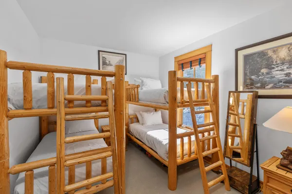 a bedroom with furniture and a window