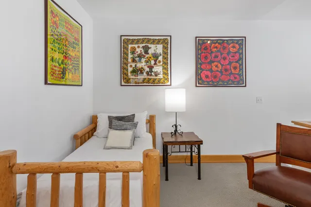 a bedroom with furniture and a window