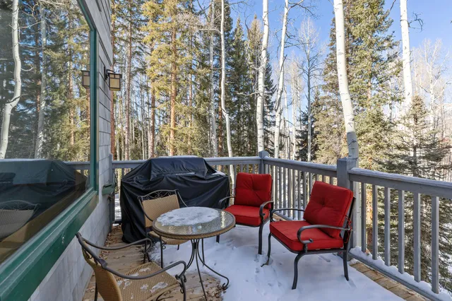 a view of a balcony with chairs