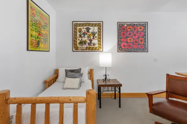 a bedroom with furniture and a window