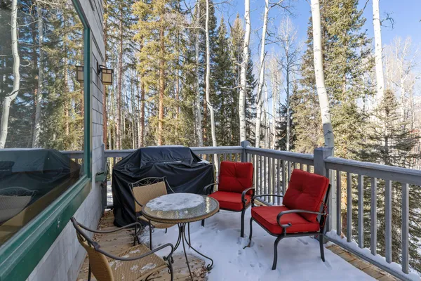 a view of a balcony with chairs