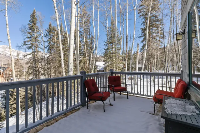 a view of a balcony with chairs