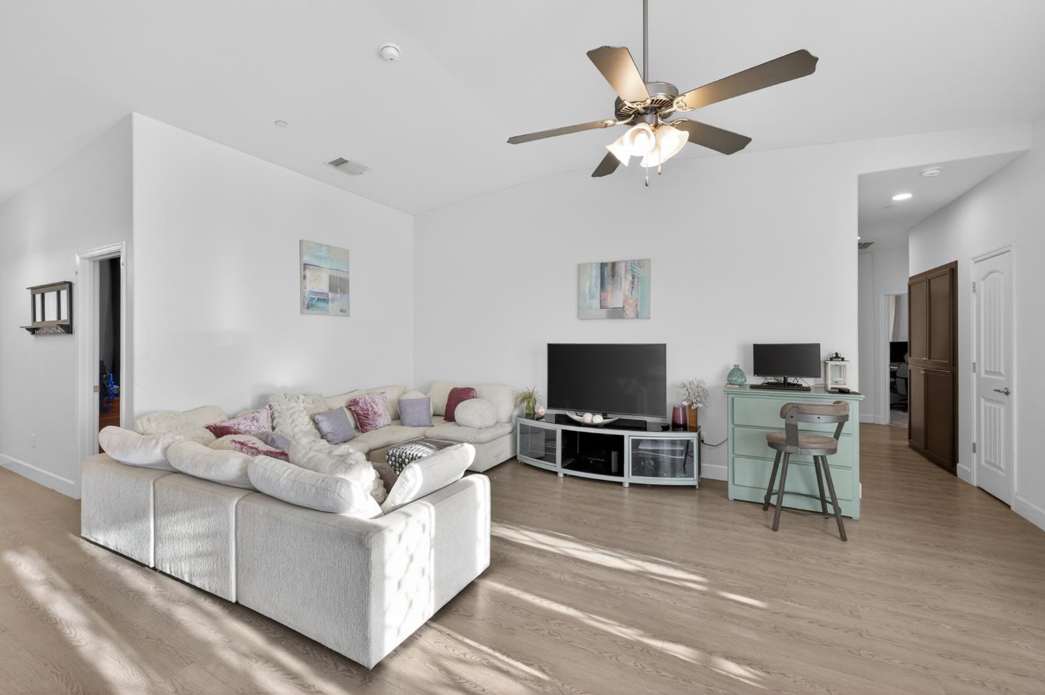 1208 Monterey Street Madera, CA 93637 - Photo 11 of 38 a living room with furniture and a flat screen tv