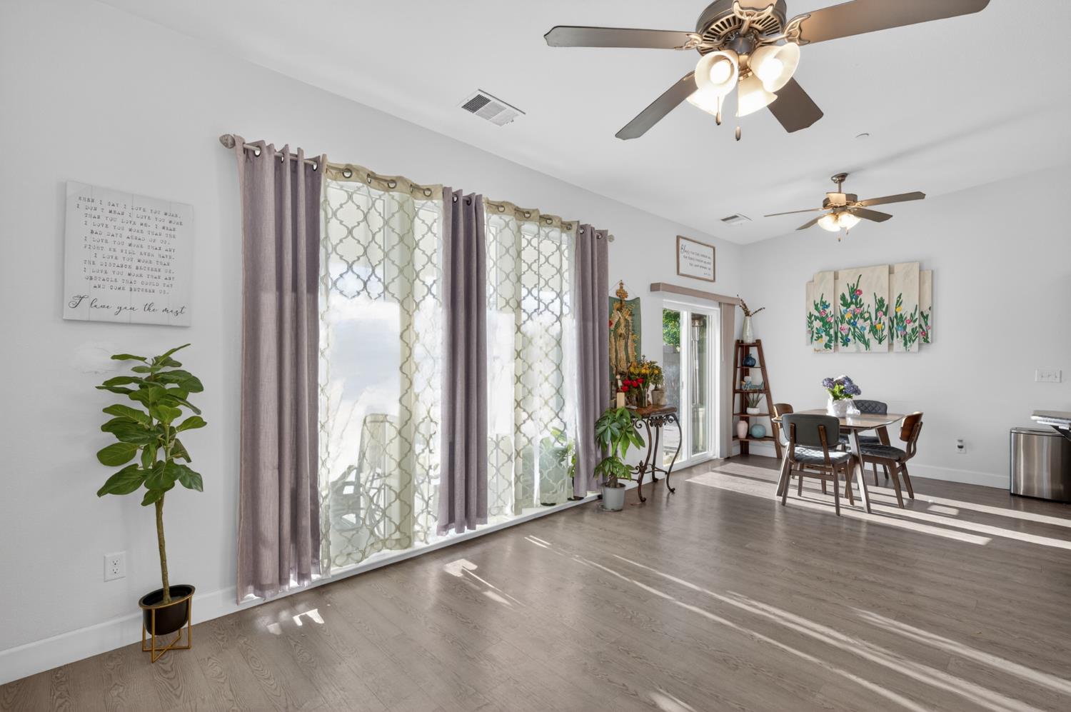 1208 Monterey Street Madera, CA 93637 - Photo 13 of 38 a view of a livingroom with furniture window and wooden floor