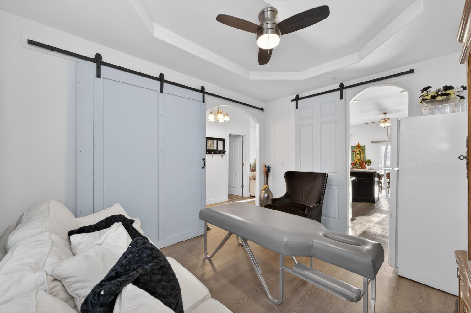1208 Monterey Street Madera, CA 93637 - Photo 21 of 38 a view of a livingroom with furniture and a ceiling fan