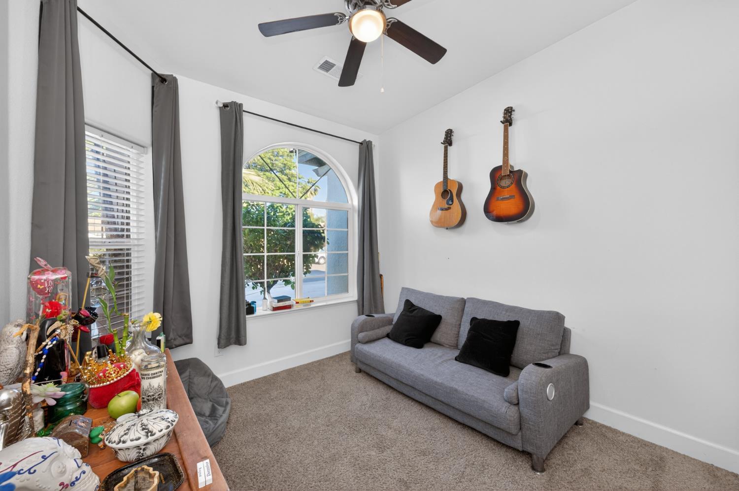 1208 Monterey Street Madera, CA 93637 - Photo 22 of 38 a living room with furniture and a large window