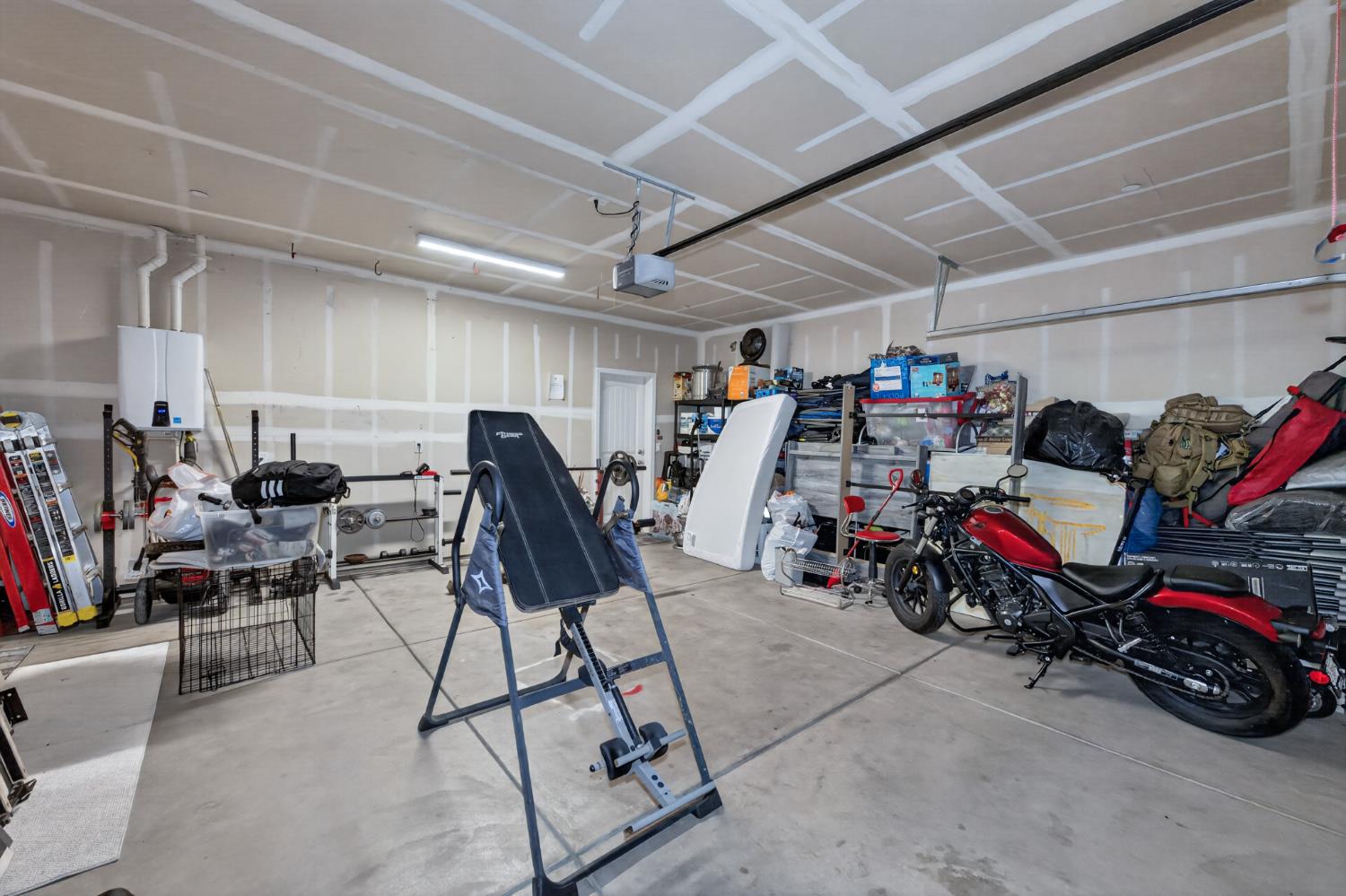 1208 Monterey Street Madera, CA 93637 - Photo 33 of 38 a view of a storage room with gym equipment