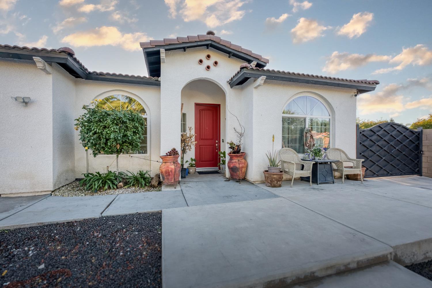 1208 Monterey Street Madera, CA 93637 - Photo 8 of 38 a view of a house with outdoor space porch and furniture