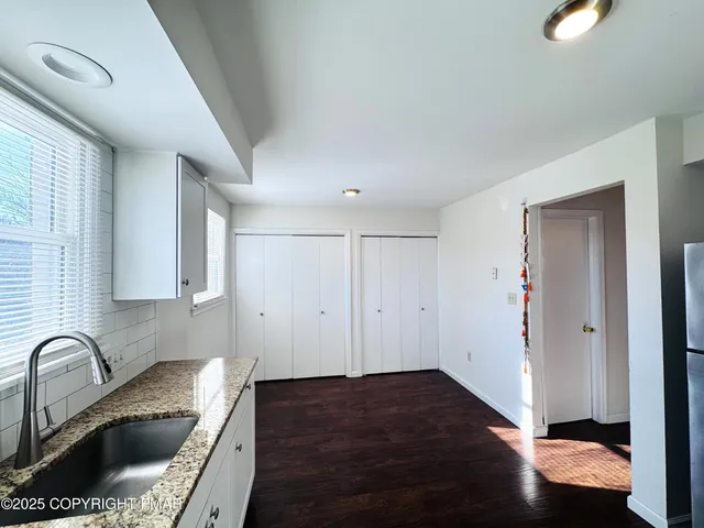 a kitchen that has a sink and a window