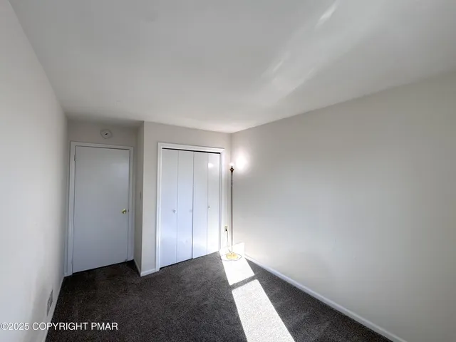 a view of a room with a large window