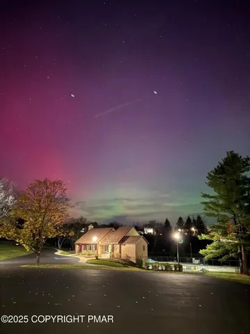 a view of swimming pool with a table and chairs