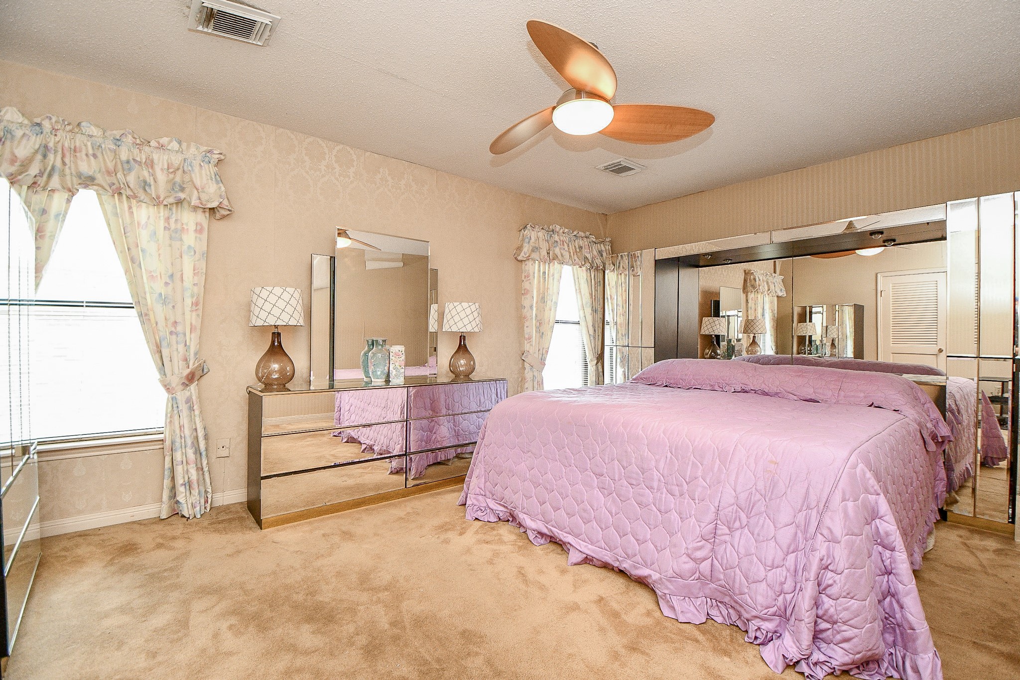 3217 Calumet Street Houston, TX 77004 - Photo 14 of 20 a bed room with a bed and a large window