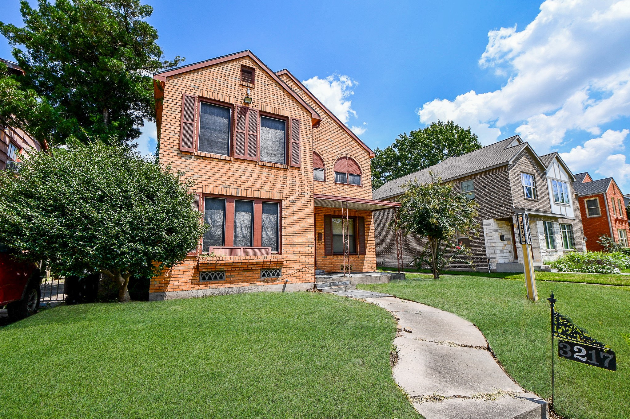 3217 Calumet Street Houston, TX 77004 - Photo 2 of 20 a front view of a house with a yard