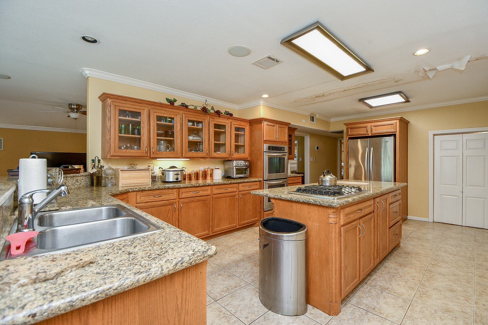 3217 Calumet Street Houston, TX 77004 - Photo 9 of 20 a kitchen with stainless steel appliances granite countertop a sink and a stove