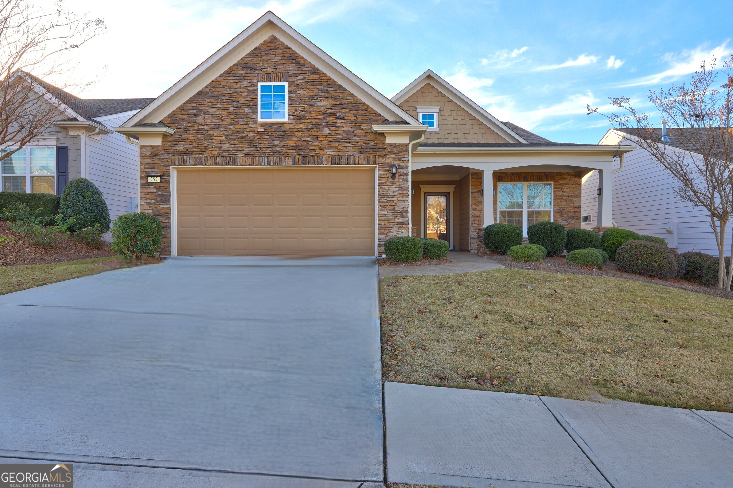 front view of a house with a yard